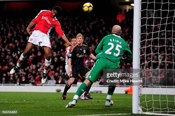 Abou Diaby of Arsenal heads the first goal of the game during the Barclays Premier League match between Arsenal and Liverpool at Emirates Stadium on...