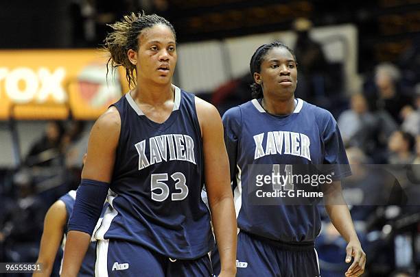 Ta'Shia Phillips and Amber Harris of the Xavier Musketeers walk down the court against the George Washington Colonials on February 3, 2010 at the...