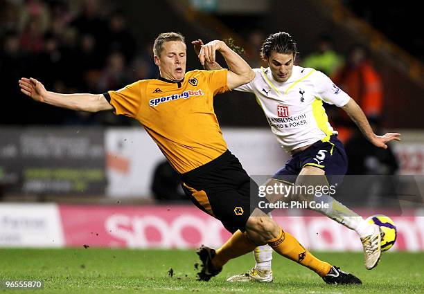 David Bentley of Tottenham Hotspur clashes with Christophe Berra of Wolverhampton Wanderers during the Barclays Premier League match between...