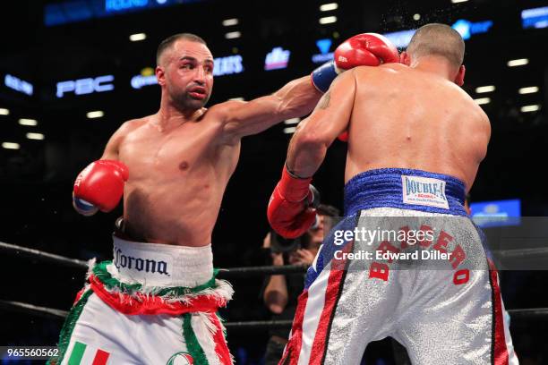 Paul Malignaggi lands a left hand against Gabriel Bracero at the Barclays Center in the Brooklyn borough New York on July 30, 2016. Malignaggi would...