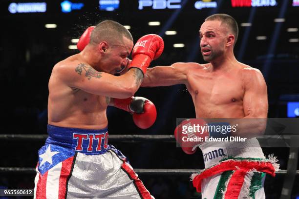 Paul Malignaggi lands a right hand against Gabriel Bracero at the Barclays Center in the Brooklyn borough New York on July 30, 2016. Malignaggi would...
