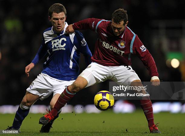 Alessandro Diamanti of West Ham United battles for the ball with Liam Ridgewell of Birmingham City during the Barclays Premier League match between...