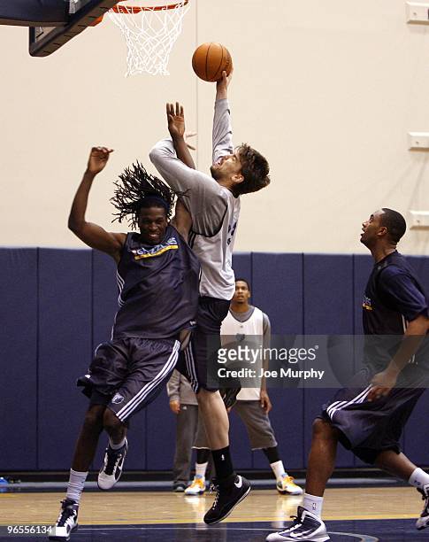 Marc Gasol of the Memphis Grizzlies shoots a layup over DeMarre Carroll of the Memphis Grizzlies during a team practice on February 4, 2010 at...