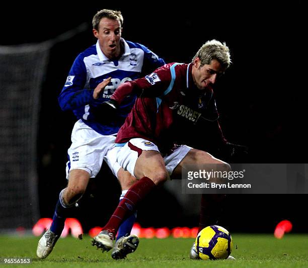 Valon Behrami of West Ham United avoids Lee Bowyer of Birmingham City during the Barclays Premier League match between West Ham United and Birmingham...
