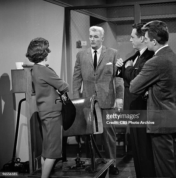 Actors Barbara Hale as Della Street, William Hopper as Paul Drake, Raymond Burr as Perry Mason and Karl Held as David Gideon perform in a scene from...