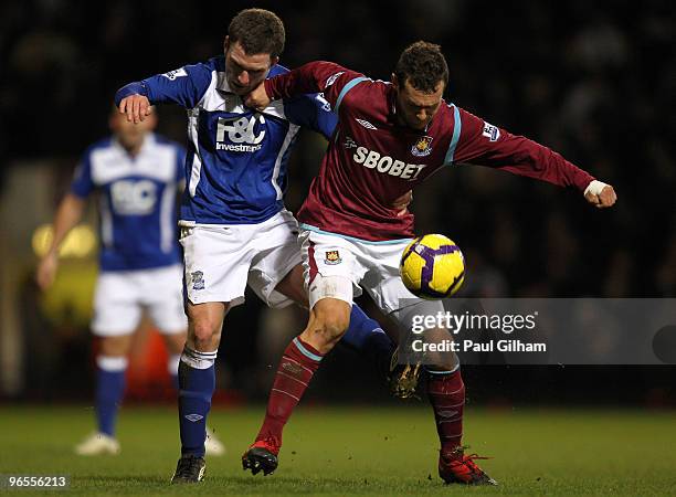 Alessandro Diamanti of West Ham United battles for the ball with Liam Ridgewell of Birmingham City during the Barclays Premier League match between...