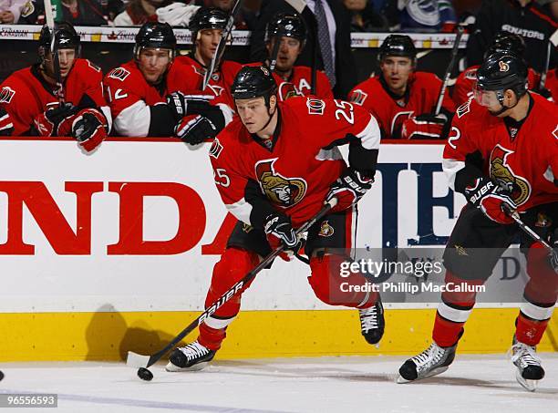 Chris Neil of the Ottawa Senators skates with the puck against the Vancouver Canucks during the NHL game at Scotiabank Place on February 4, 2010 in...
