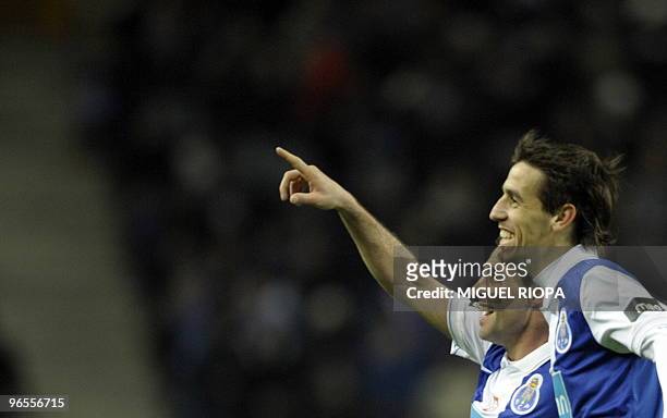 Porto's forward from Argentina Mariano Gonzalez celebrates with team midfielder from Argentina Tomas Costa after scoring a goal against Academica...