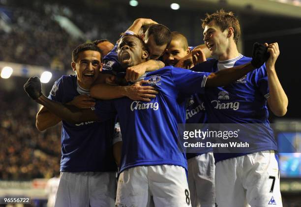 Louis Saha of Everton celebrates scoring his team's second goal with his team mates during the Barclays Premier League match between Everton and...