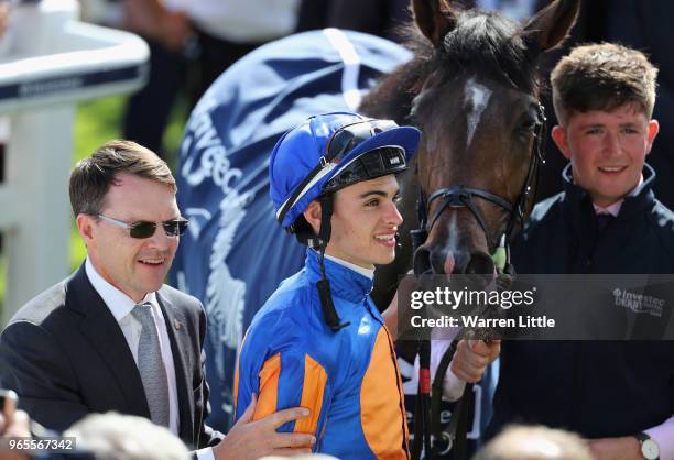 Forever Together Trainer Aidan O'Brien and Jockey Donnacha O'Brien celebrate after winning the Investec Oaks during the Investec Ladies Day at Epsom...