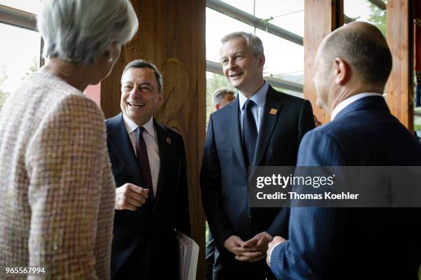 German Finance Minister Olaf Scholz speaks to Christine Lagarde , Managing Director of the International Monetary Fund, Mario Draghi , president of...