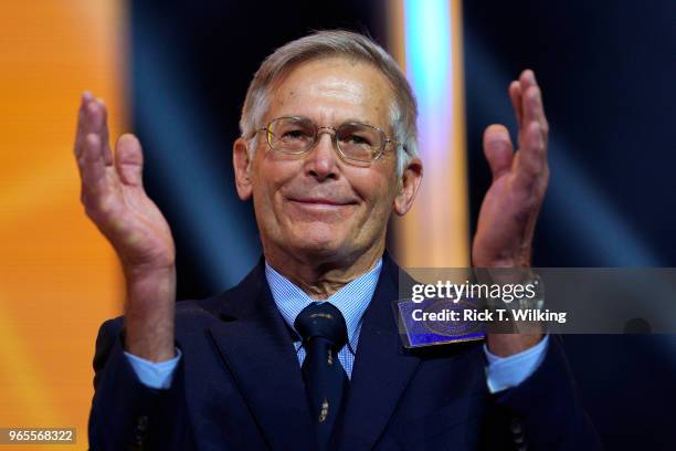 Jim Walton claps at the Walmart shareholders meeting event on June 1, 2018 in Fayetteville, Arkansas. The shareholders week brings thousands of...