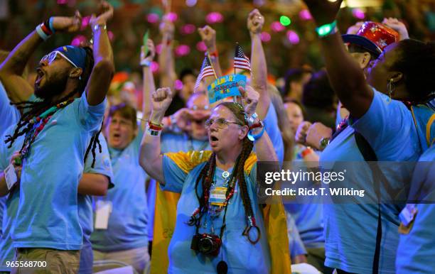 Walmart associates cheer during the annual shareholders meeting event on June 1, 2018 in Fayetteville, Arkansas. The shareholders week brings...