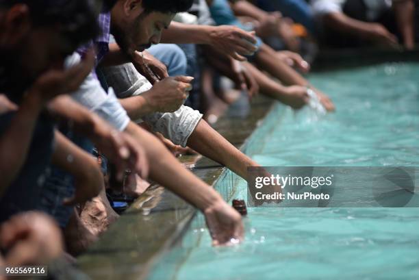 Nepalese Muslim washes his hands, face and feet before offering ritual prayers of Ramadan at Kashmiri Takiya Jame mosque at Kathmandu, Nepal on...