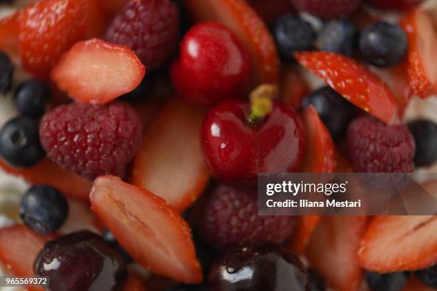 delicious pavlova cake with berries and cherries - iliana mestari stock pictures, royalty-free photos & images