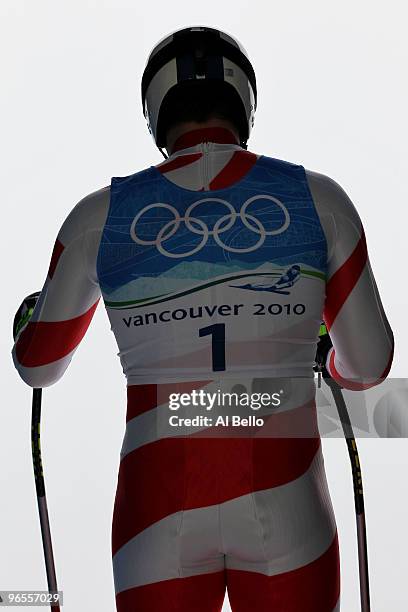 Tobias Gruenenfelder of Switzerland practices during the Men's Downhill skiing 1st training run ahead of the Vancouver 2010 Winter Olympics on...