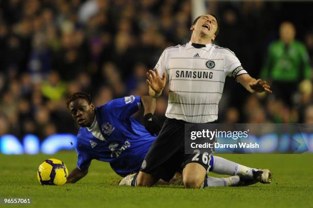 Louis Saha of Everton brings down John Terry of Chelsea during the Barclays Premier League match between Everton and Chelsea at Goodison Park on...