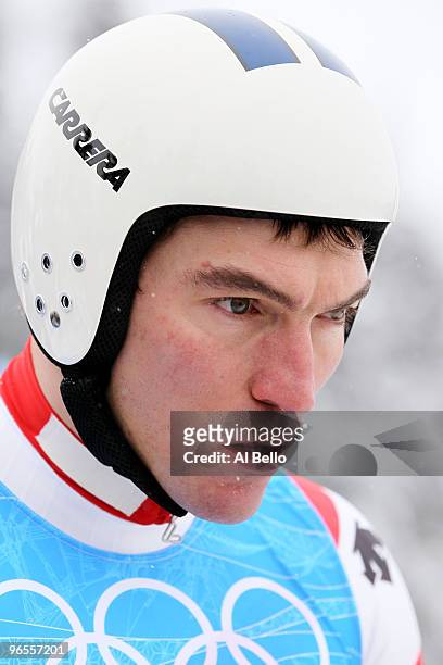 Tobias Gruenenfelder of Switzerland practices during the Men's Downhill skiing 1st training run ahead of the Vancouver 2010 Winter Olympics on...