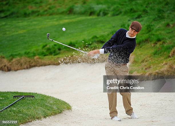 Actor Oliver Hudson hits from a bunker on during the 3M Celebrity Challenge at the AT&T Pebble Beach National Pro-Am at Pebble Beach Golf Links on...