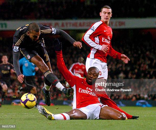 David Ngog of Liverpool is tackled by William Gallas of Arsenal during the Barclays Premier League match between Arsenal and Liverpool at Emirates...