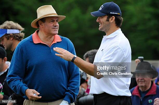 Dallas Cowboys quarterback Tony Romo Talks to sports announcer Chris Berman during the 3M Celebrity Challenge at the AT&T Pebble Beach National...