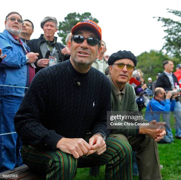 Musician Huey Lewis and actor Andy Garcia watch the action on the 3rd tee during the 3M Celebrity Challenge at the AT&T Pebble Beach National Pro-Am...