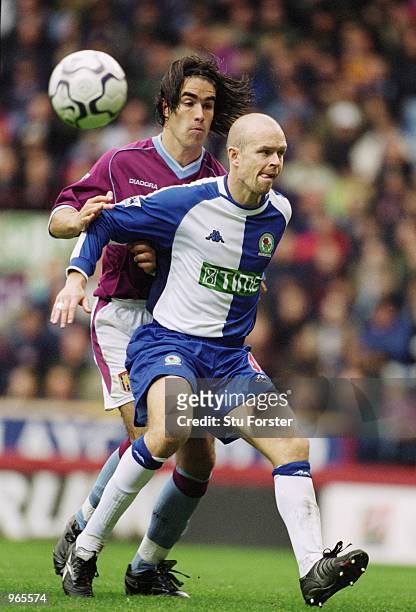 Henning Berg of Blackburn Rovers blocks Juan Pablo Angel of Aston Villa route to goal during the FA Barclaycard Premiership match played at Villa...