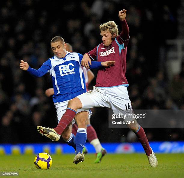 West Ham's Swiss player Valon Behrami vies with Birmingham CIty's English striker Kevin Phillips during the English Premier League football match...