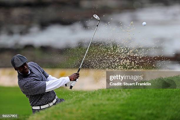 Actor Don Cheadle plays a bunker shot during the 3M Celebrity Challenge at the AT&T Pebble Beach National Pro-Am at Pebble Beach Golf Links on...