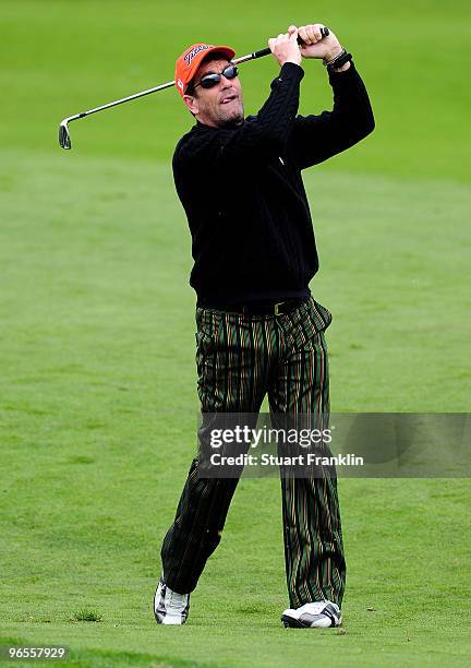 Musician Huey Lewis plays a shot during the 3M Celebrity Challenge at the AT&T Pebble Beach National Pro-Am at Pebble Beach Golf Links on February...