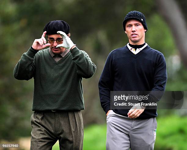 Andy Garcia and playing partner Jeffrey Donovan talk during the 3M Celebrity Challenge at the AT&T Pebble Beach National Pro-Am at Pebble Beach Golf...