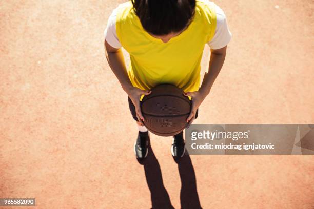 love for basketball - woman yellow basketball stock pictures, royalty-free photos & images