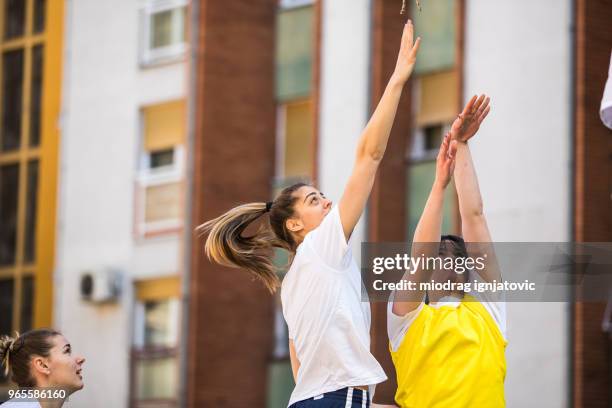 loving the game - woman yellow basketball stock pictures, royalty-free photos & images