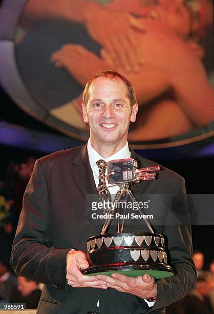 Olympic record breaker Steve Redgrave of Great Britain poses with the winning BBC Sports Personality of the Year Award held at the BBC Television...