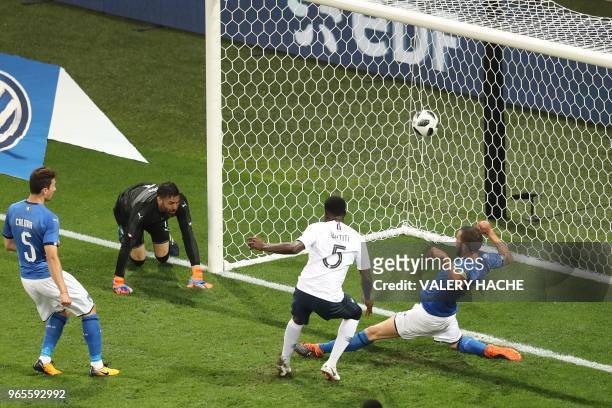 France's defender Samuel Umtiti shoots and scores a goal during the friendly football match between France and Italy at the Allianz Riviera Stadium...