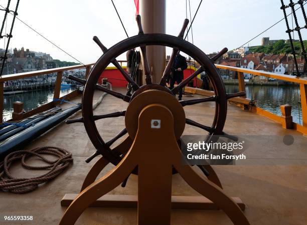 Detail of the helm of HM Bark Endeavour, a replica of Captain Cook's famous ship, HMS Endeavour as it is tied up in Whitby Harbour following...
