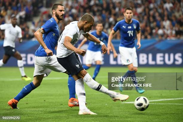 France's foward Kylian Mbappe kicks the ball during the friendly football match between France and Italy at the Allianz Riviera Stadium in Nice,...