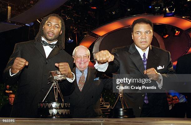 Boxing legends past and present Lennox Lewis, Harry Carpenter and Muhammad Ali pose for the cameras at the BBC Sports Personality of the Year Awards...