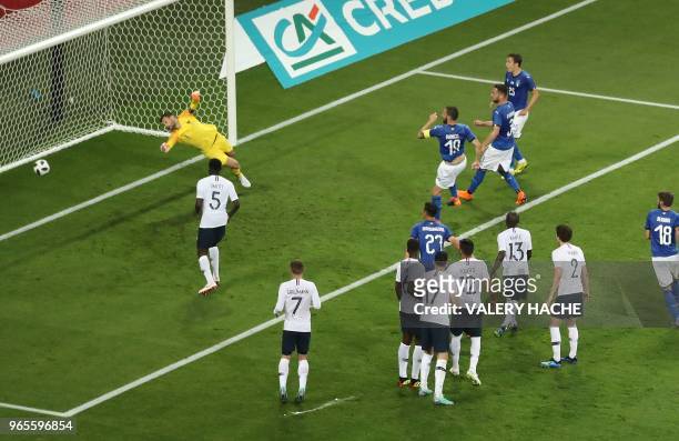 Italy's defender Leonardo Bonucci shoots and scores a goal during the friendly football match between France and Italy at the Allianz Riviera Stadium...