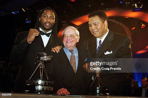 Boxing legends past and present Lennox Lewis, Harry Carpenter and Muhammad Ali pose for the cameras at the BBC Sports Personality of the Year Awards...