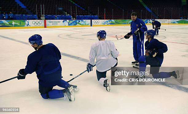 Finland's ice hockey head coach Jukka Jalonen attends a practice at the Canada Hockey Place ice ring in Vancouver ahead of the opening of the 2010...