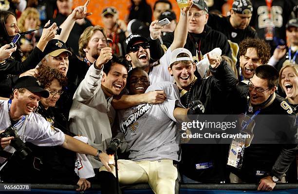 Reggie Bush of the New Orleans Saints celebrates with fans after defeating the Indianapolis Colts during Super Bowl XLIV on February 7, 2010 at Sun...