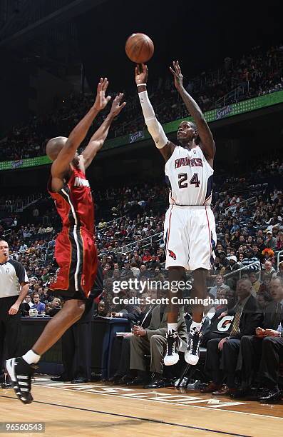 Marvin Williams of the Atlanta Hawks puts up a shot against Rafer Alston of the Miami Heat on February 10, 2010 at Philips Arena in Atlanta, Georgia....