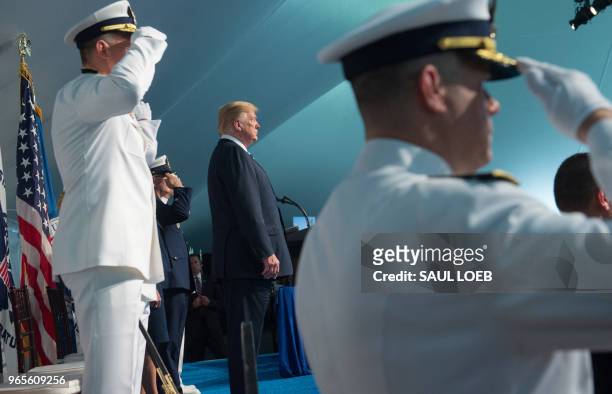 President Donald Trump looks on during a Change of Command ceremony as Admiral Karl Schultz takes over from Admiral Paul Zukunft as the Commandant of...