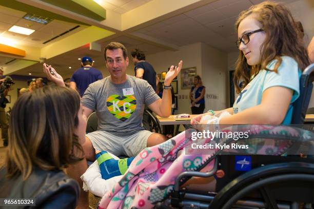 Rob Riggle and Laura Marano talks to a patient at Children's Mercy Hospital during the Big Slick Celebrity Weekend benefitting Children's Mercy...