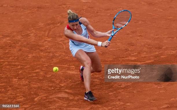Pauline Parmentier of France returns the ball to Caroline Wozniacki of Denmark during the third round at Roland Garros Grand Slam Tournament - Day 6...