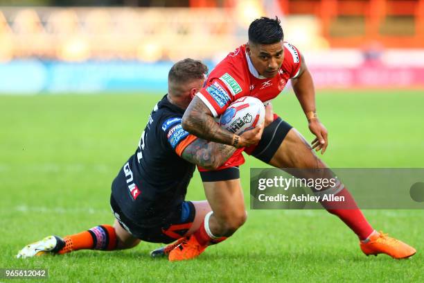 Junior Vaivai of Hull KR is tackled by Jamie Ellis of Castleford Tigers during the Roger Millward Trophy match between Hull KR and Castleford Tigers...