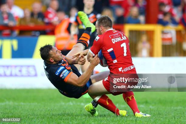 Adam Quinlan of Hull KR pushes off Greg Eden of Castleford Tigers during the Roger Millward Trophy match between Hull KR and Castleford Tigers as...