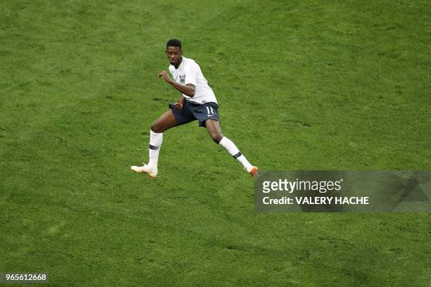 France's foward Ousmane Dembele celebrates after scoring a goal during the friendly football match between France and Italy at the Allianz Riviera...