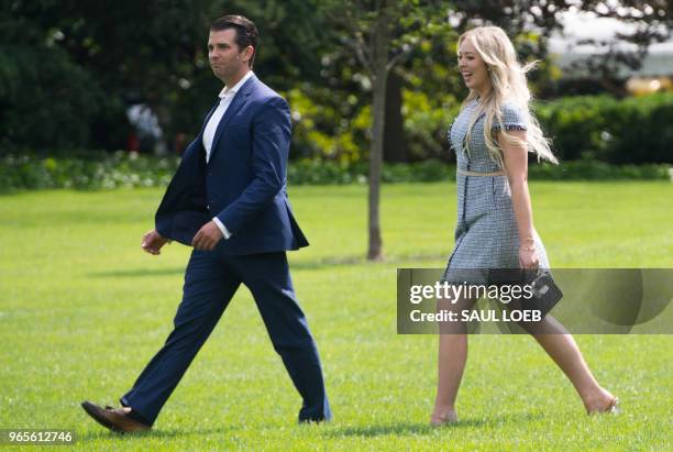 Donald Trump, Jr., and Tiffany Trump, children of US President Donald Trump, walk to Marine One prior to departing from the South Lawn of the White...